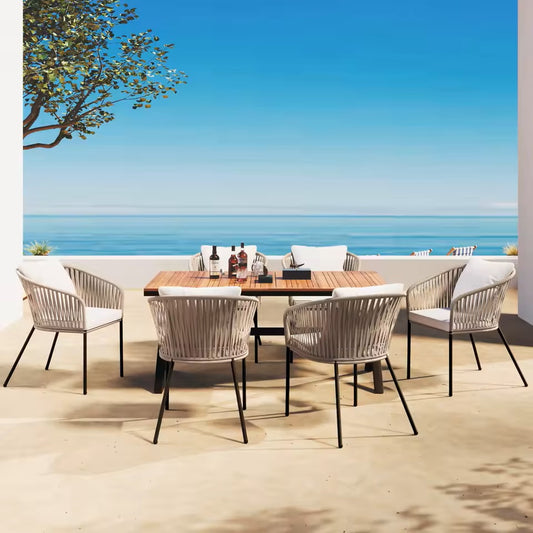 7-piece modern outdoor dining set with black metal table and hand-woven wicker chairs. 1